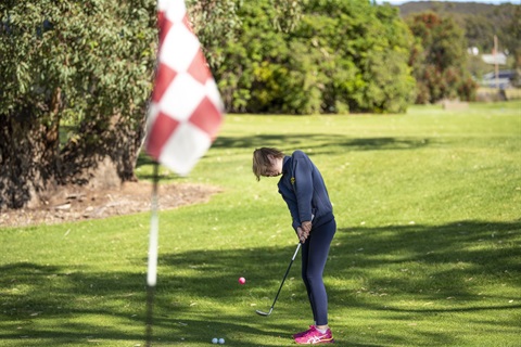 Man playing golf